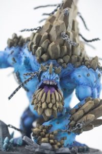 a very animated blue monster action figure painted with extreme detail